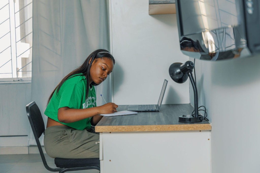 Students studying in a residence lounge